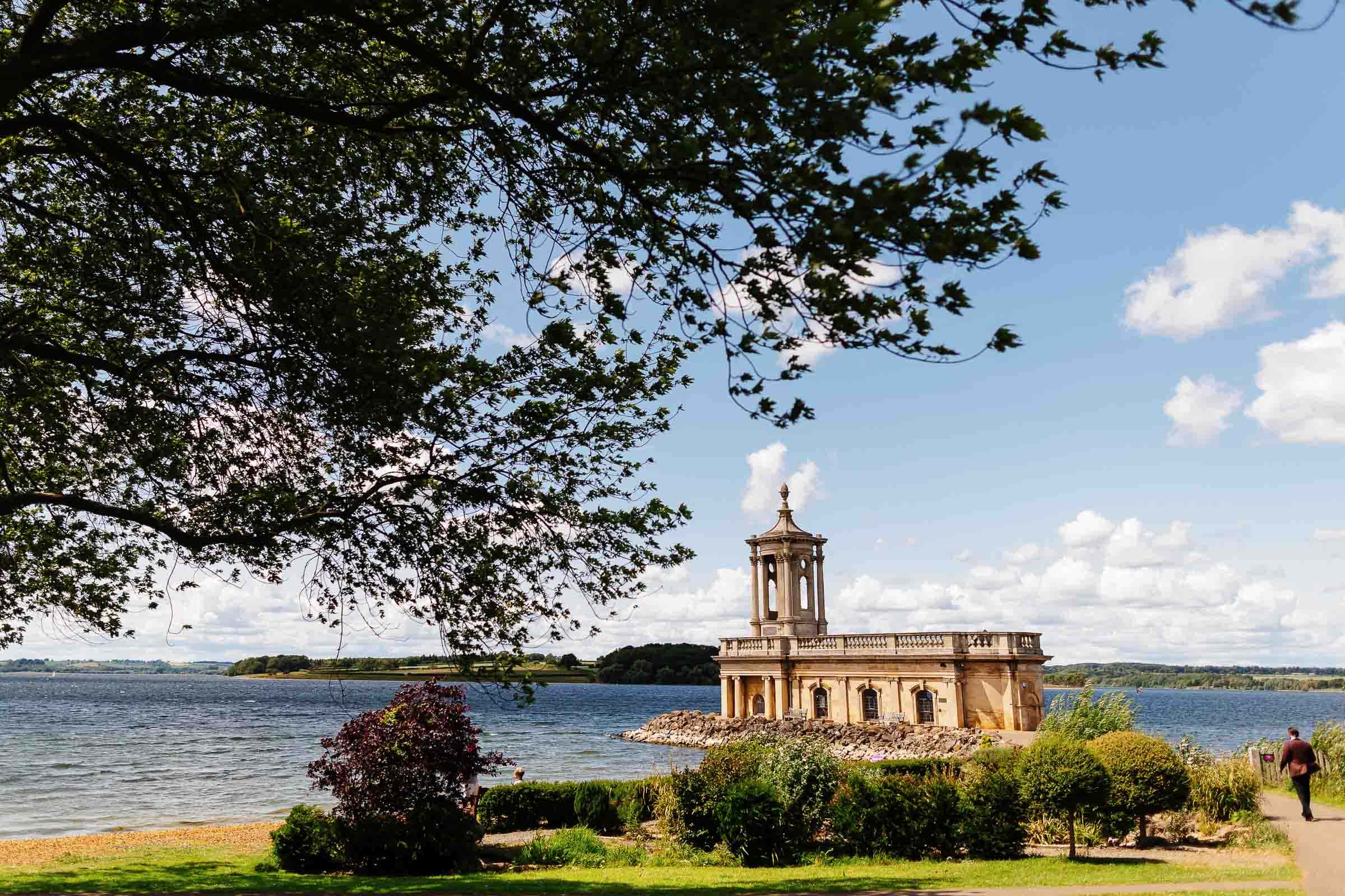 Beautiful lakeside wedding venue with historic pavilion, landscaped gardens, and scenic views ideal for weddings and outdoor events in the UK. Perfect setting for wedding photography.