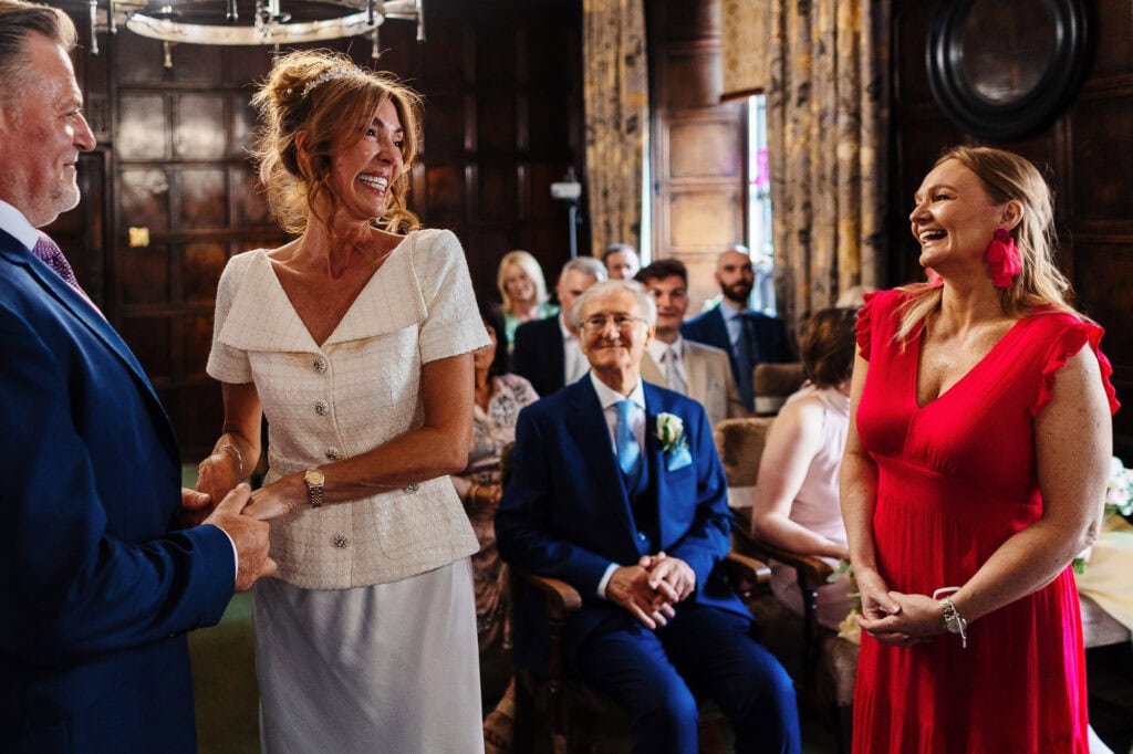 Vibrant wedding ceremony captured at BGS Weddings in a historic venue, showcasing joyful guests, elegant attire, and a memorable exchange of vows. Ideal for wedding planning and venue inspiration.