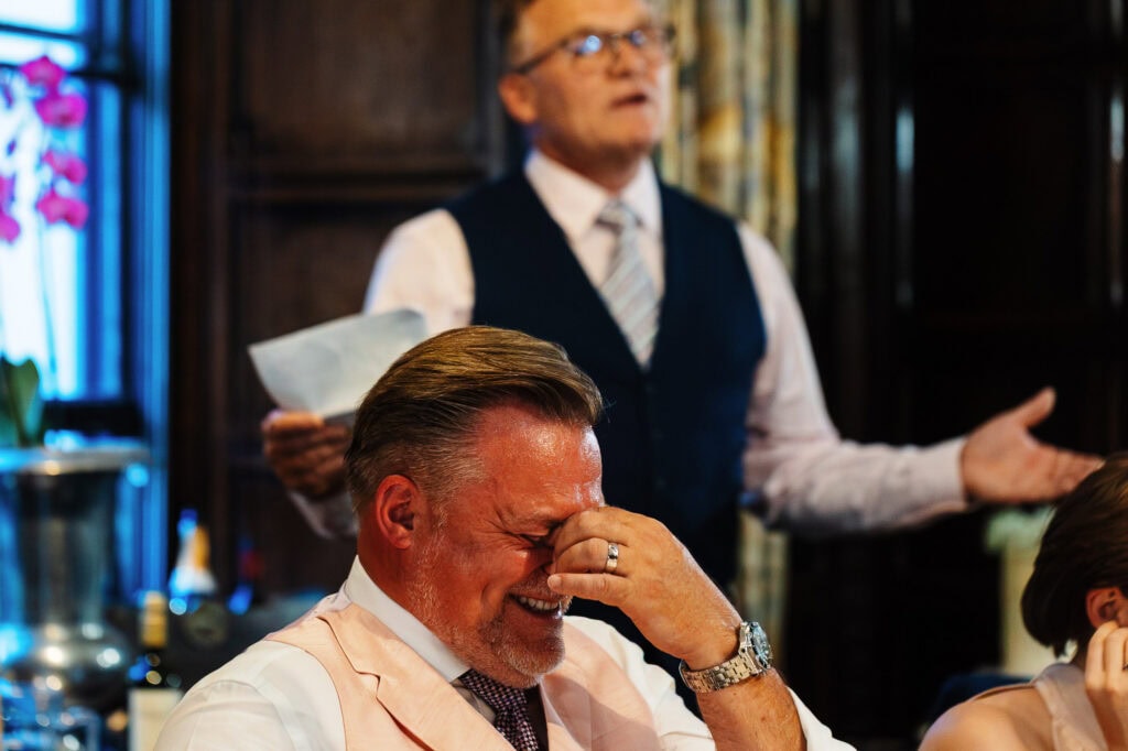 Elegant wedding toast at a BGS Weddings ceremony, capturing heartfelt emotions and joyful moments among guests, with a focus on wedding celebration and special vows.