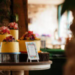 Delicious wedding cakes with colourful flowers displayed at BGS Weddings, perfect for memorable wedding celebrations.