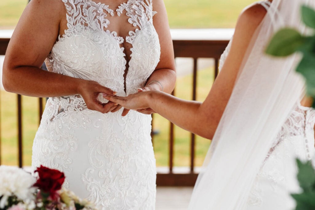 Elegant wedding dress with intricate lace detailing for a romantic bride at BGS Weddings UK.