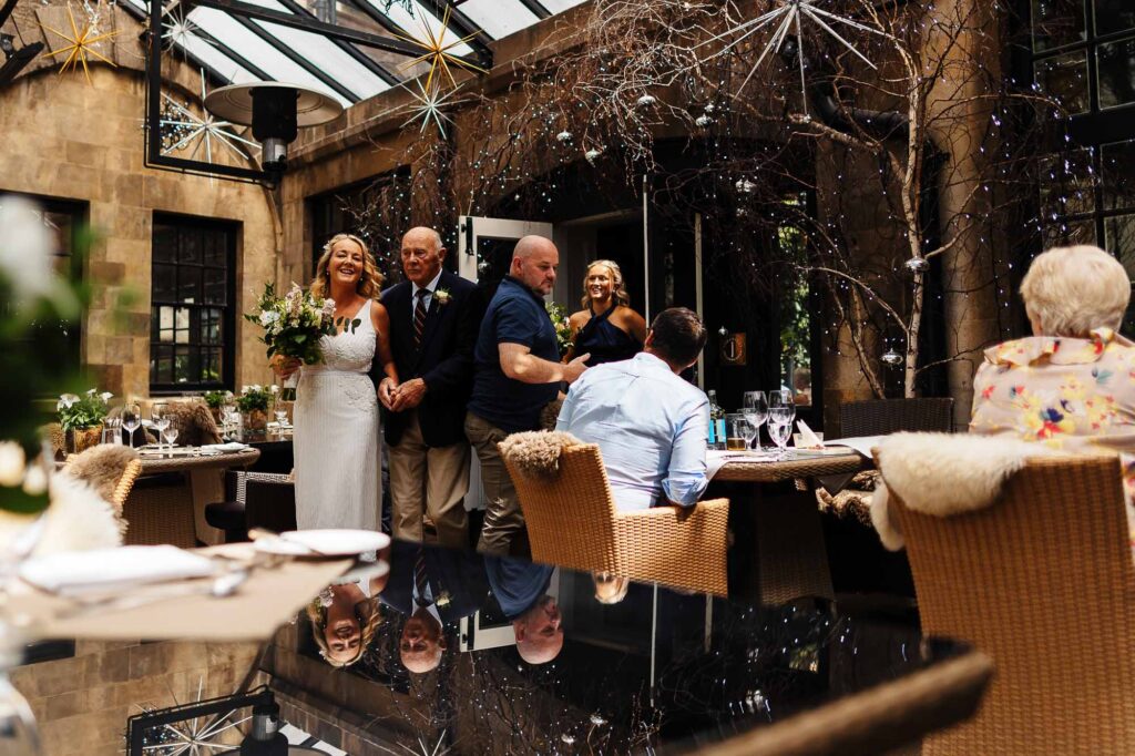 Elegant wedding reception at BGS Weddings, showcasing beautifully decorated tables and joyful moments in an outdoor garden setting.