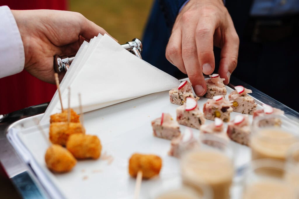 Delicious wedding canapés served at a BGS Weddings outdoor reception, featuring finger foods and savoury bites for guests to enjoy during the celebration.