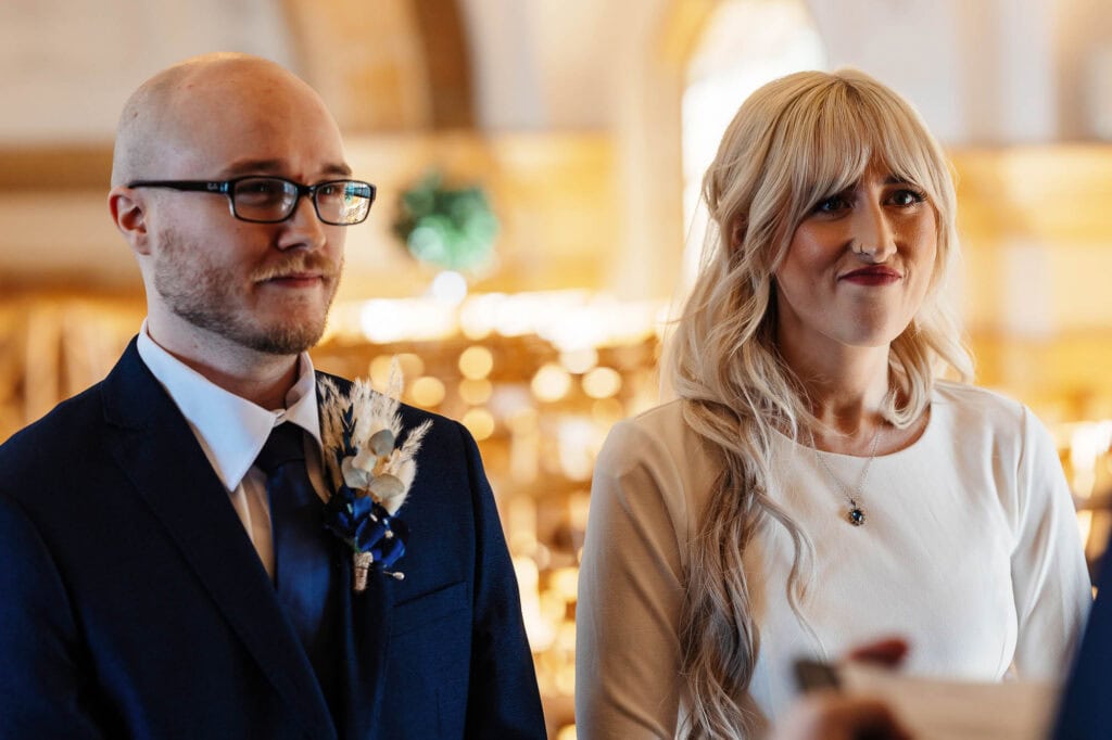 Wedding ceremony at BGS Weddings, happy couple exchanging vows in a beautiful indoor setting.