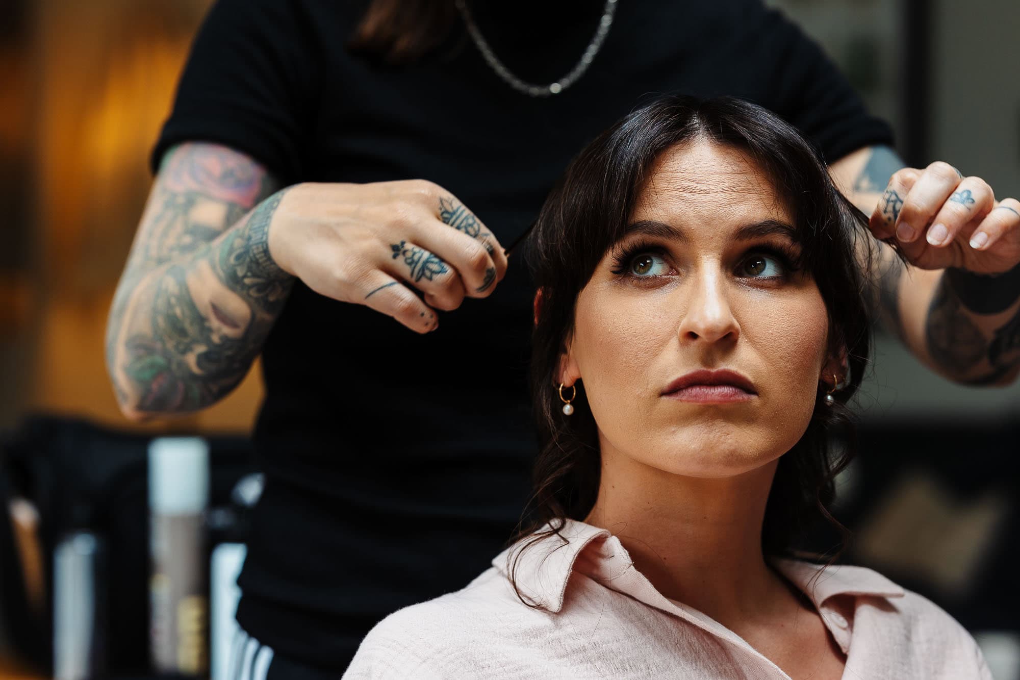 Professional hairstylist styling a bride's hair for her wedding at BGS Weddings, showcasing expert hairdressing services for brides in the UK.