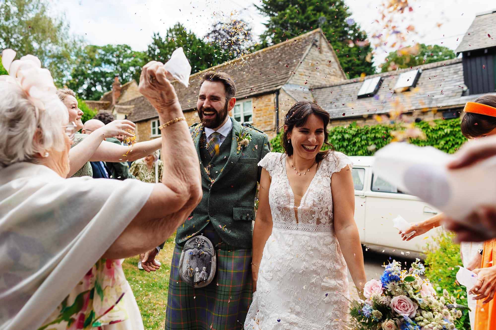 Wedding celebration at BGS Weddings, outdoor ceremony with happy couple and guests.