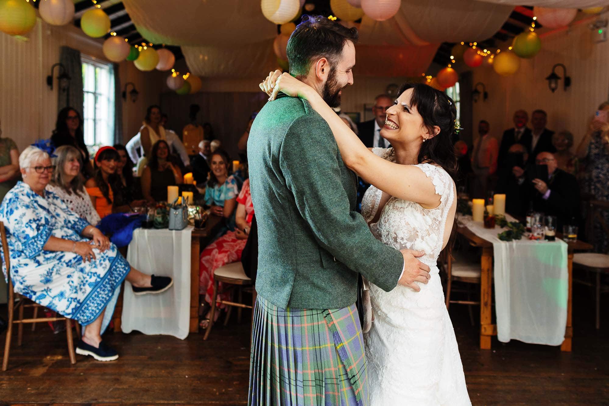 Elegant wedding dance with bride and groom at reception.